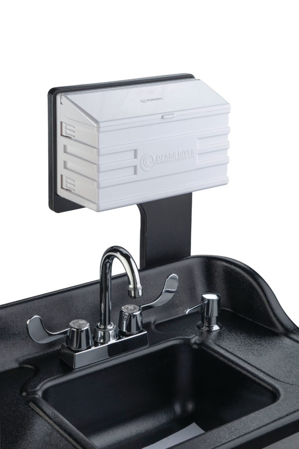 Black ABS countertop with attached m-fold towel dispenser and built-in soap dispenser